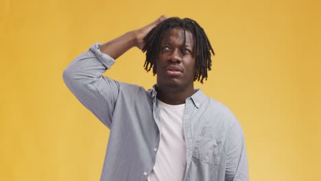 thoughtful man with dreadlocks