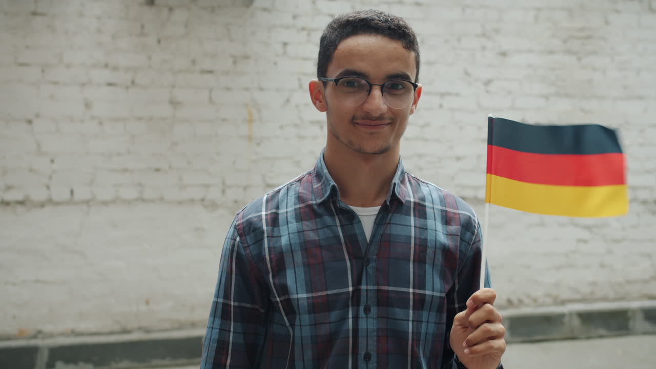 Young Man Holding German Flag