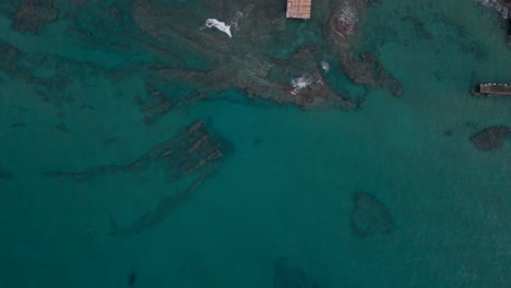 Aerial View of Rocky Coastline and Turquoise Ocean
