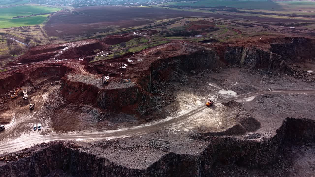 Granite quarry activity in an industrial location during daylight hours