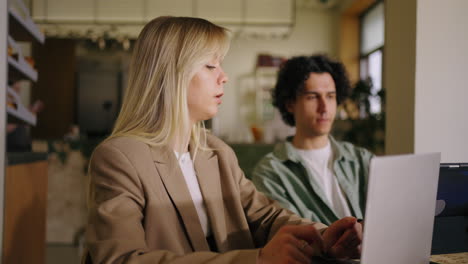 two colleagues have a business meeting at a cafe