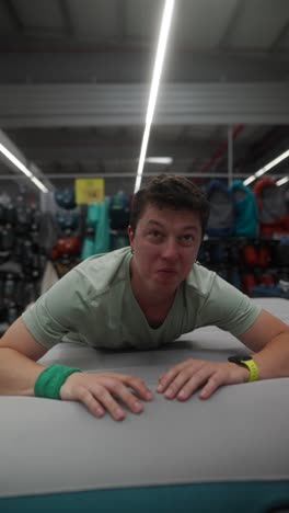 man demonstrating an air mattress