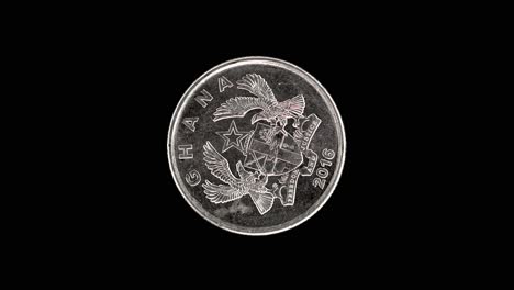 ghana 2016 10 pesewas coin obverse with national arms rotating on black background