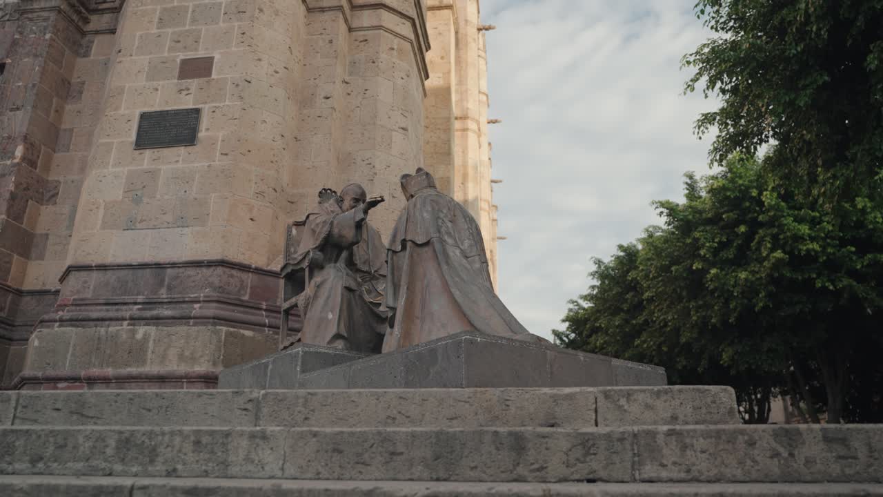 Statues in front of a historic building