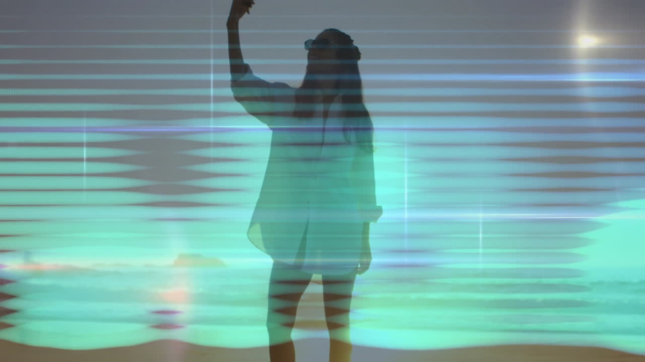 Standing with colorful digital wave patterns, person creating animation silhouette