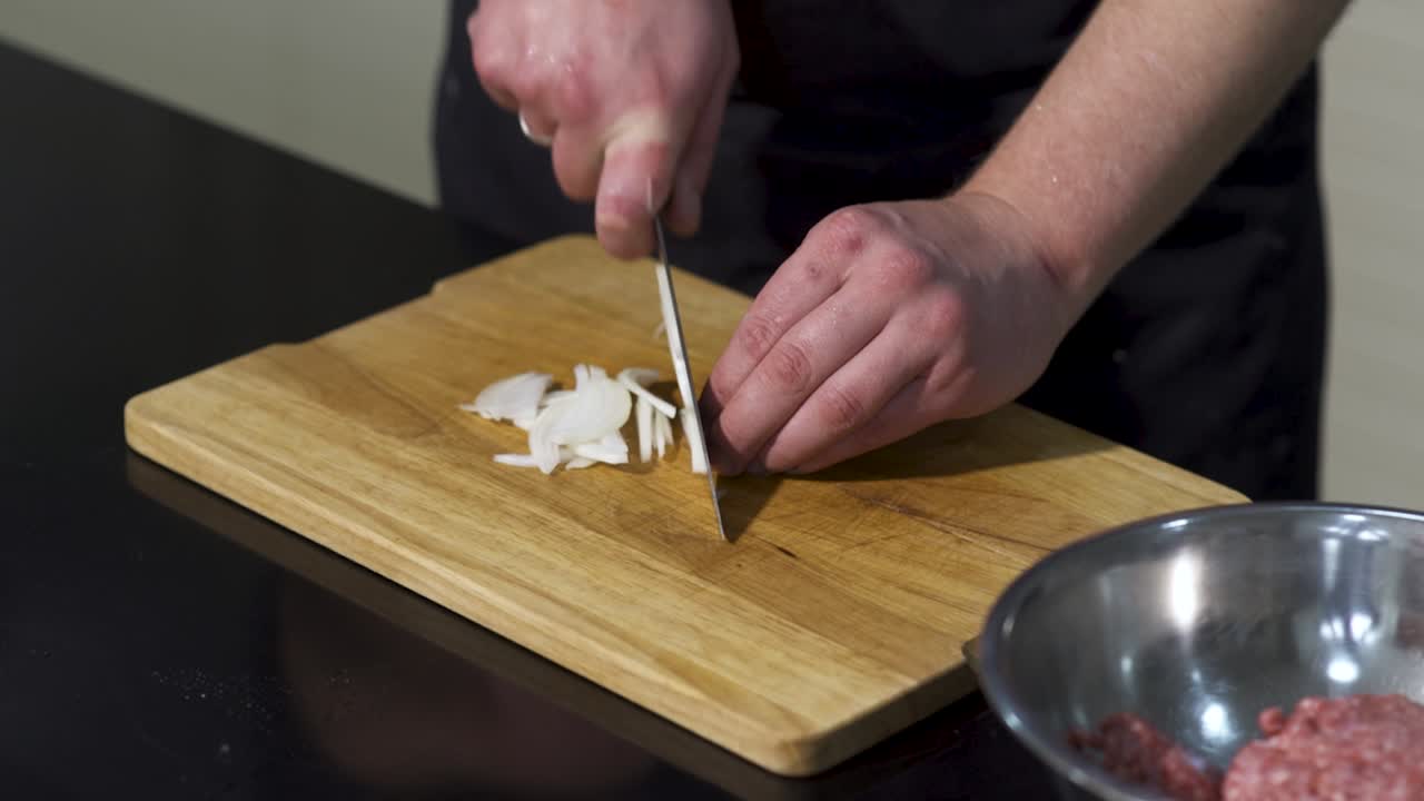 Chef Chopping Onions for a Recipe