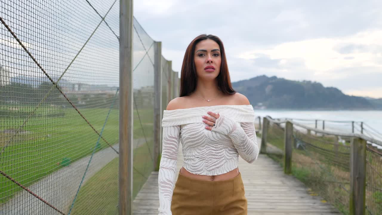 Woman on a beach walkway