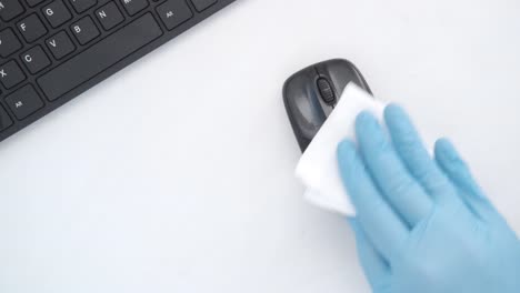 cleaning computer mouse and keyboard with gloves