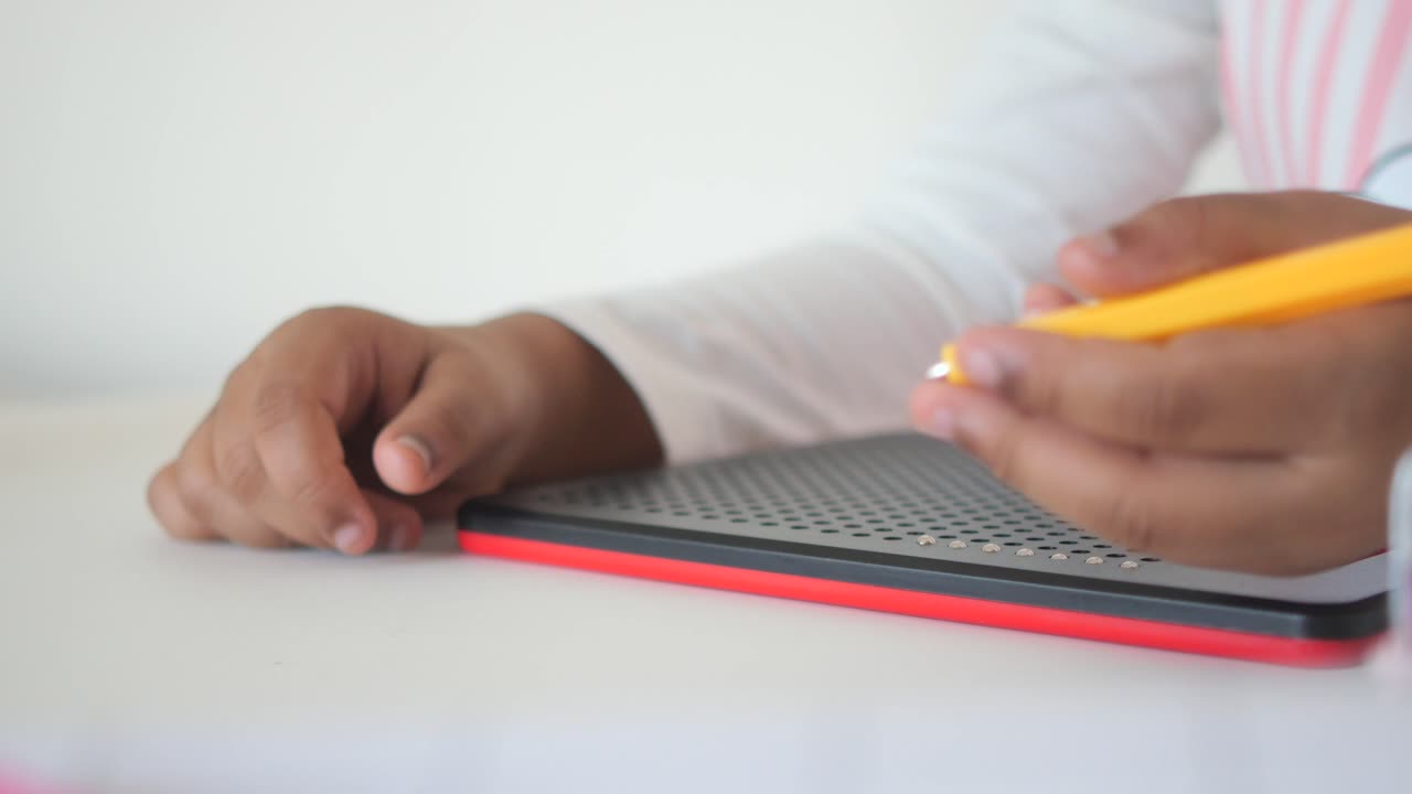 Child drawing on a magnetic drawing board