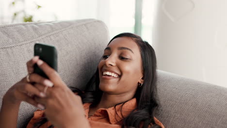 Woman,-phone-and-smile-chatting-on-living-room