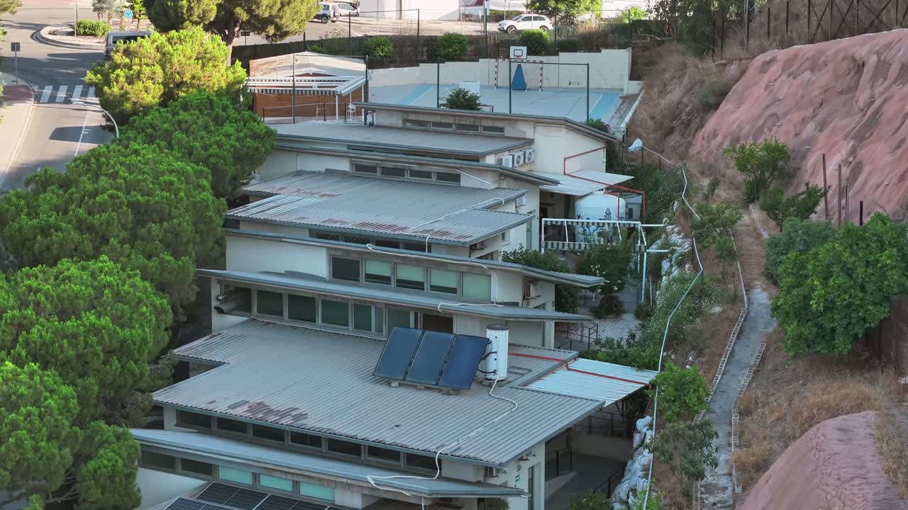 Solar panels on rooftops of buildings built on hillside of St Vincent of Paul, Granada Spain