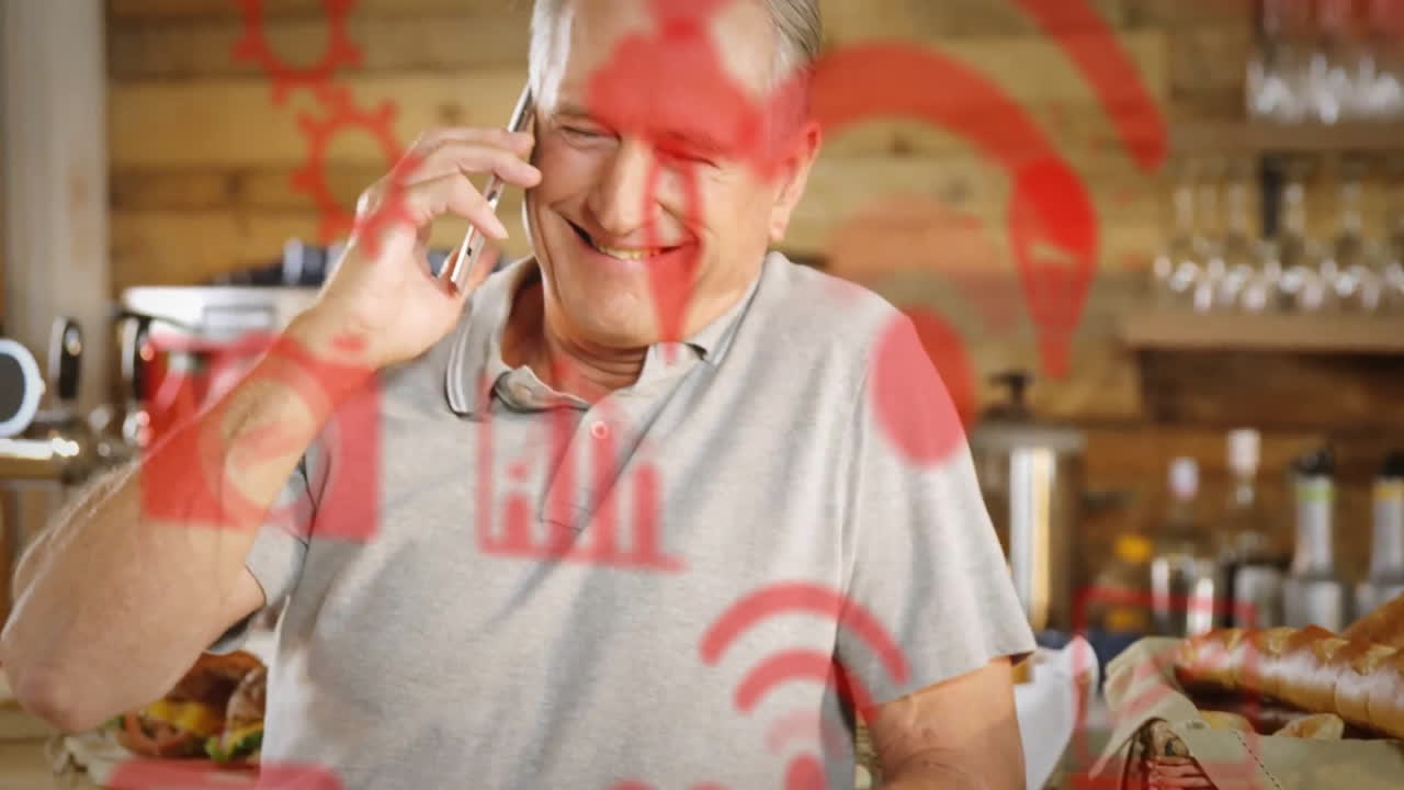 animación de iconos de medios y diagramas sobre hombre caucásico hablando en teléfono inteligente