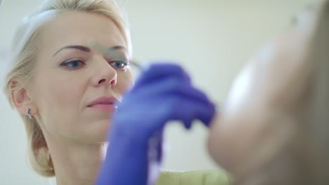 doctor examining patient teeth with dental tools. dentist treating patient teeth