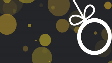 animation of christmas bauble decoration over yellow spots on black background