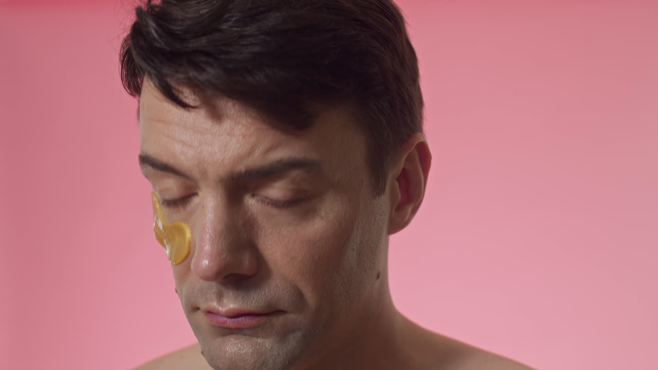 Gen Y Man Applying under Eye Patches