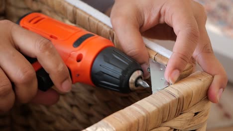 repairing or assembling a rattan basket with a cordless drill