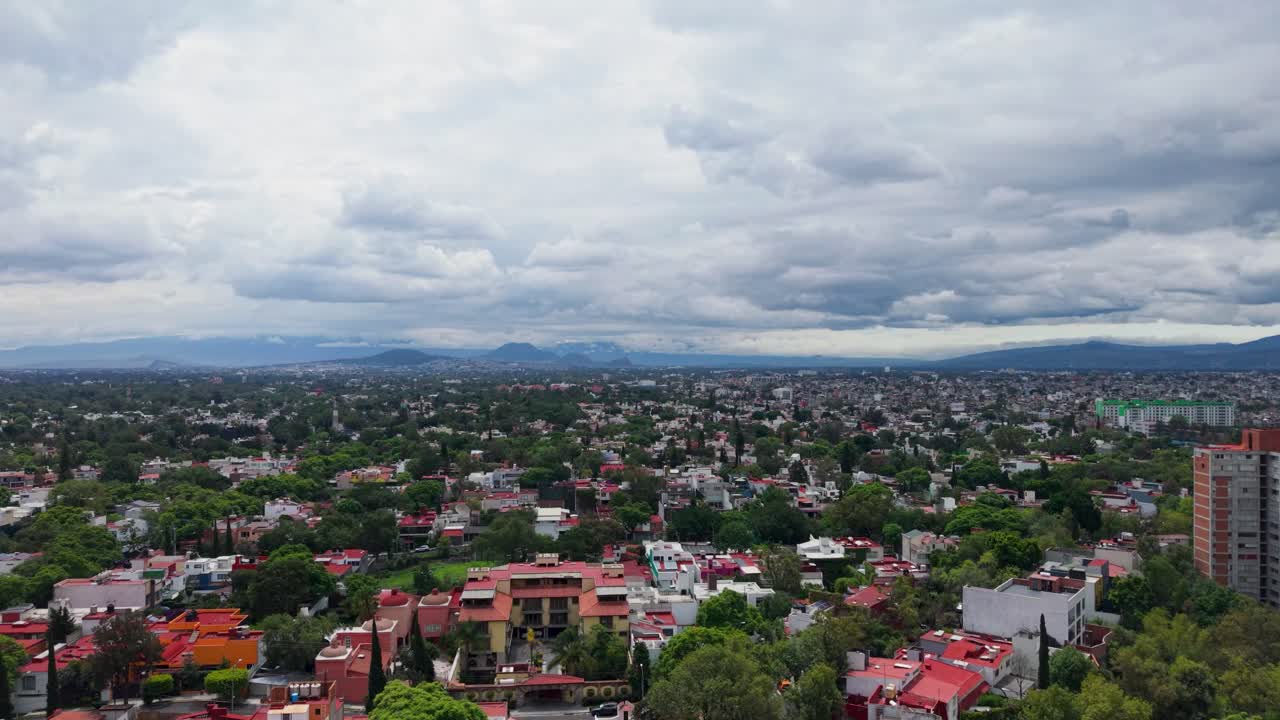 Mexico City on a grey, cloudy rainy season afternoon, captured by drone