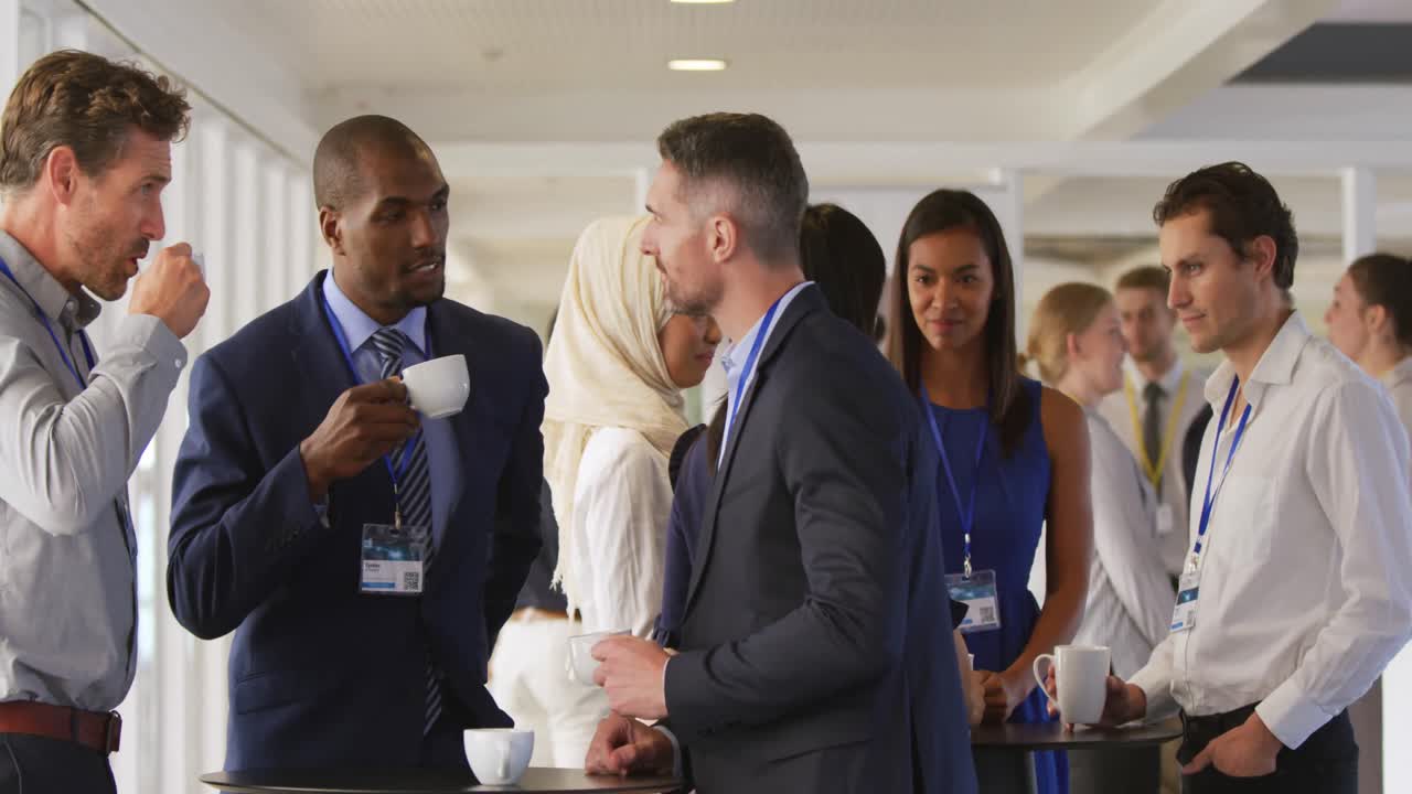 Business people talking during a coffee break at a convention