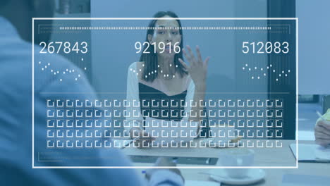 animation of processing data over biracial businesswoman talking at office meeting