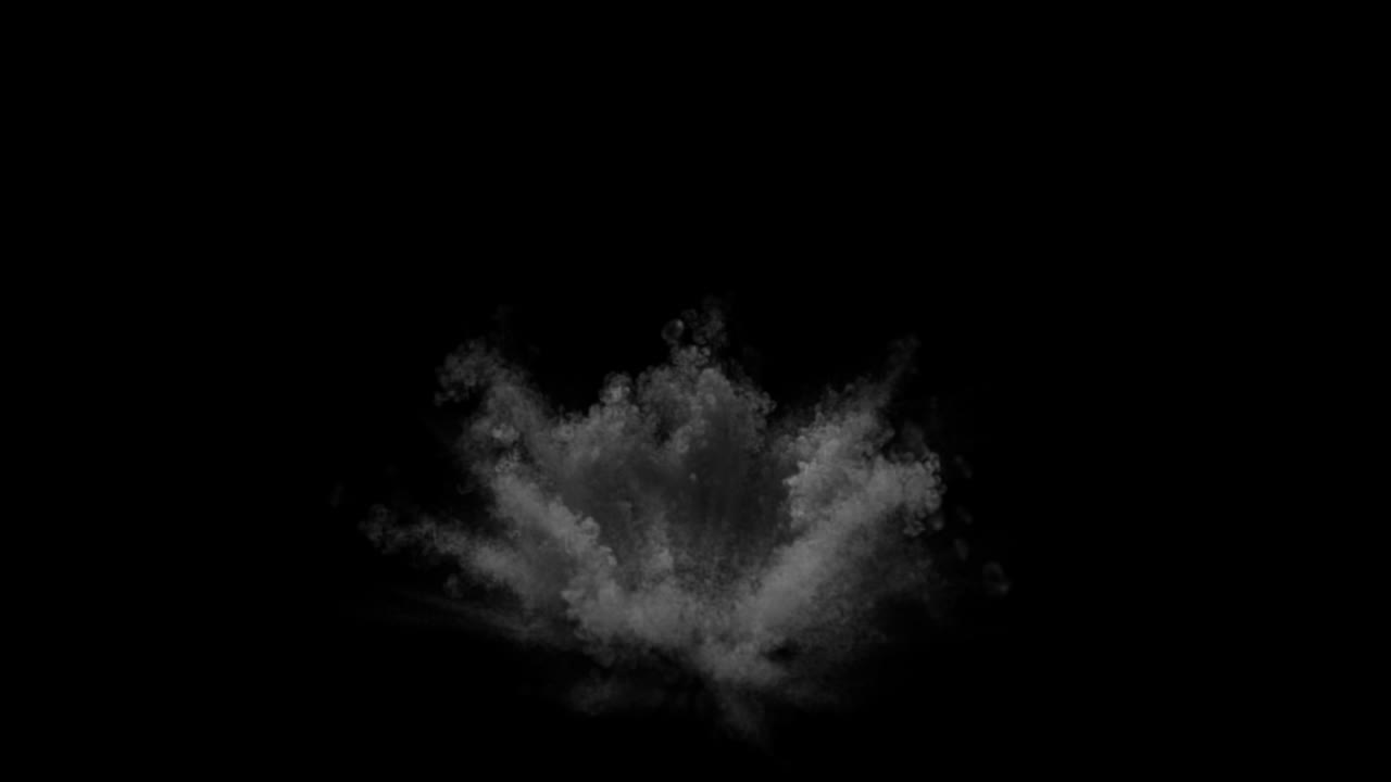 Esplosione di polvere grigia su sfondo nero