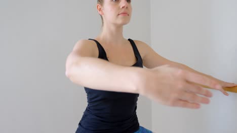 group of women exercising on the barre 4k