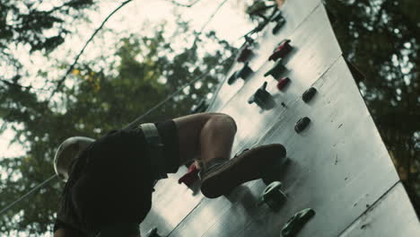 boy in a climbing wall