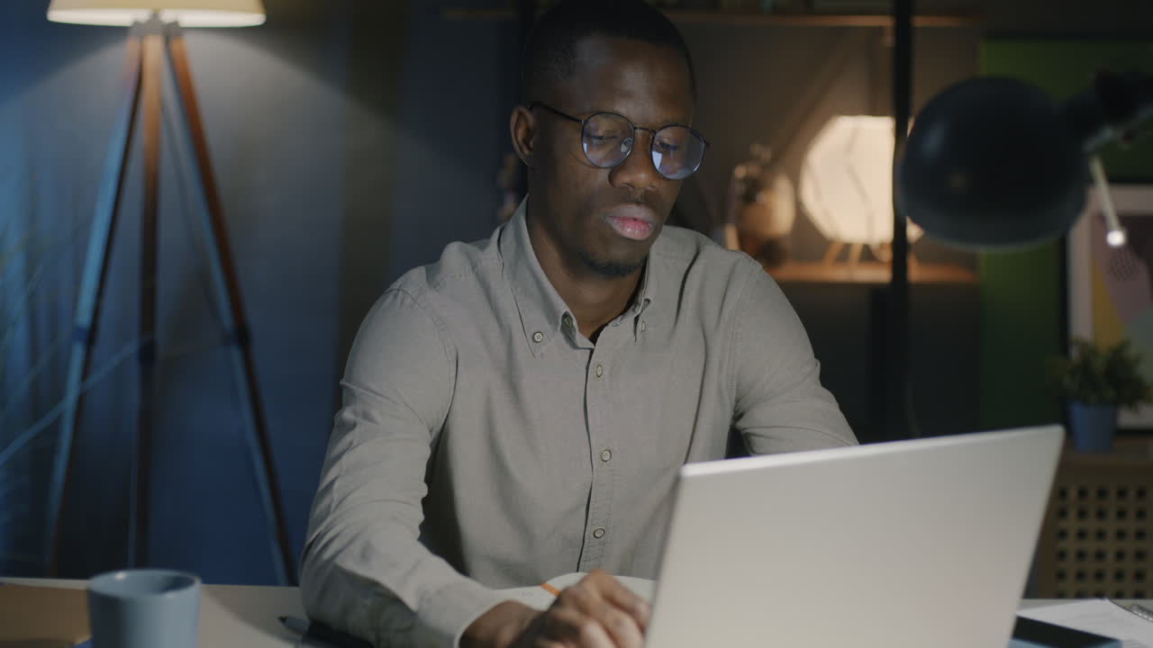 Man Working Late on Laptop