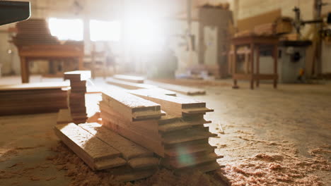 wood planks and sawdust in a woodworking shop