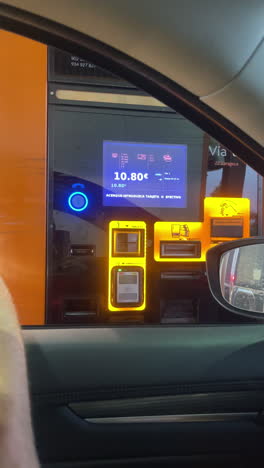 using a drive-thru payment kiosk