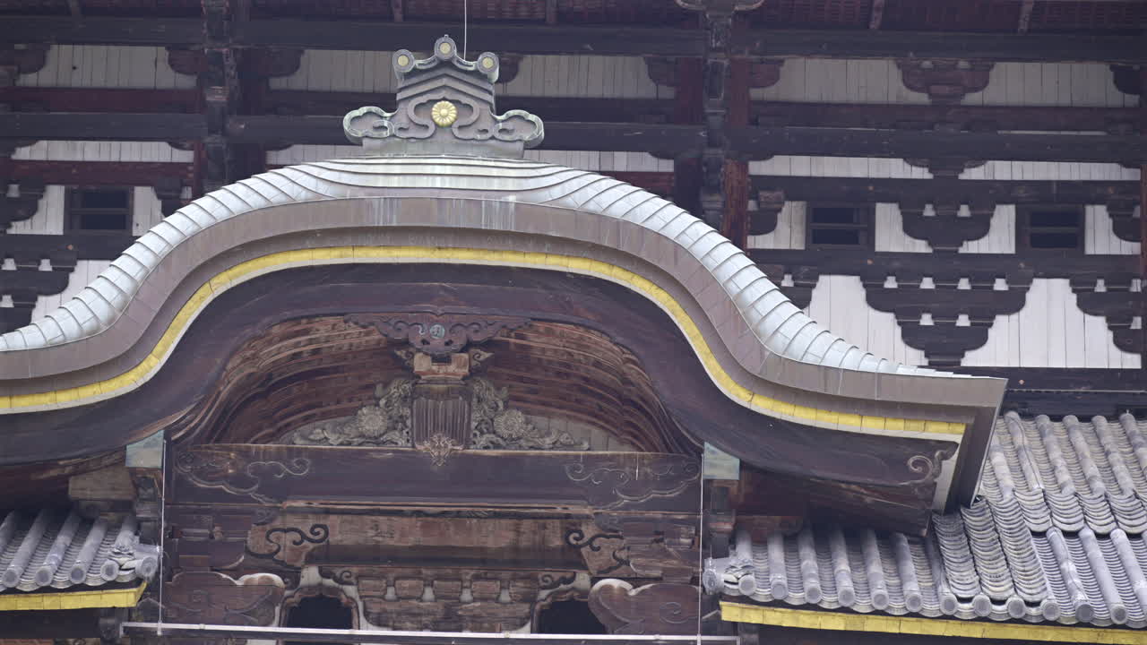 Todai-ji buddhist temple reveals detailed craftsmanship and ornate features. This unique architectural style reflects Japan's rich cultural heritage. The Great Buddha Hall