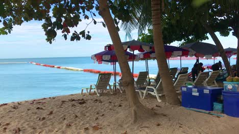 service plastic beach chairs on the beach of pattaya, thailand without customers in the era of covid-19 spreading.