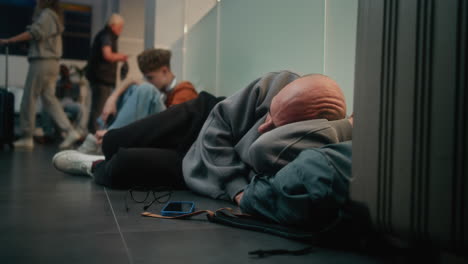 sleeping passenger at airport