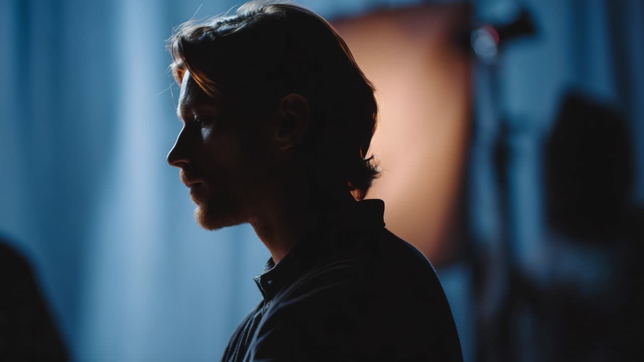 A contemplative moment captured in shadows, focusing on profile silhouettes against a softly lit backdrop and highlighting the emotional depth of introspective thought