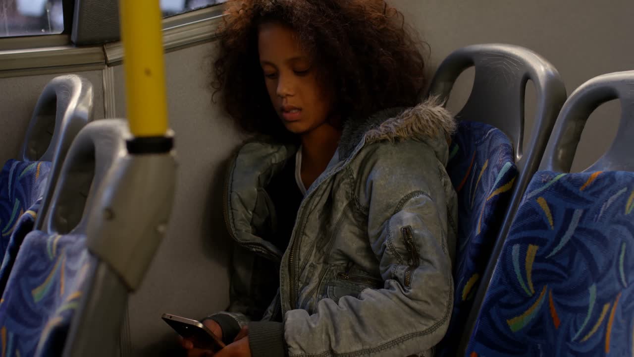 Girl using mobile while travelling in bus 4k