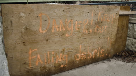 Danger-Keep-Out-Falling-Debris-Sign---Spray-Paint-On-Board