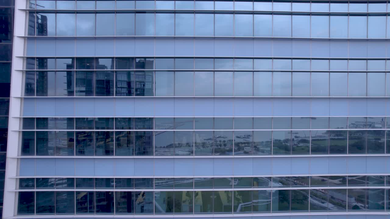 View of the empty office building windows during the day.