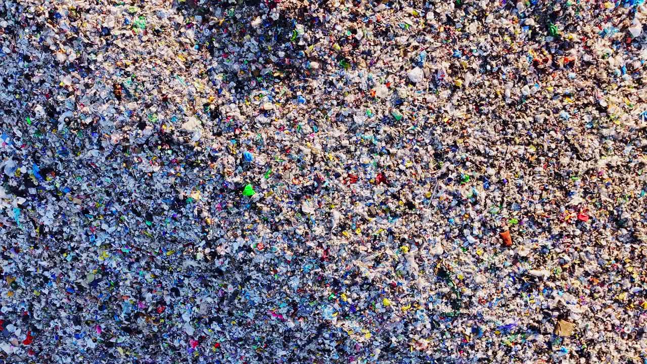 Plastic waste mountain seen from above symbolizing pollution and awareness