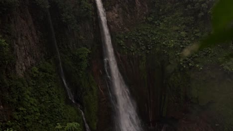 a view of the la catarata del toro waterfall in costa rica, with its impressive cascade of water plunging into a pool