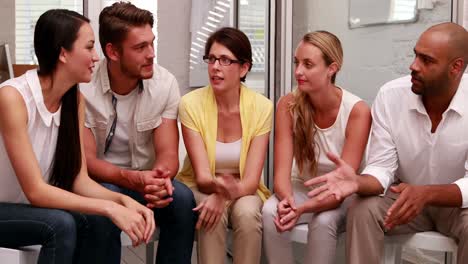 casual business team talking together in a circle