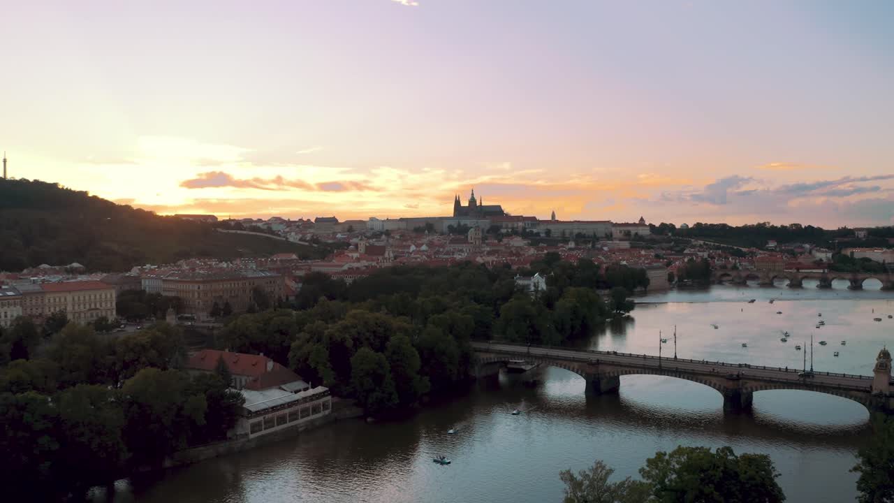 Drone aerial view of Prague Castle and Vltava river in Czech Republic, sunset time, cinematic perspective