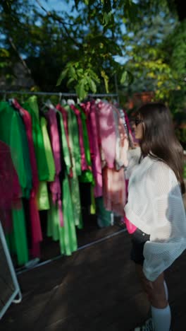 woman shopping for clothes outdoors