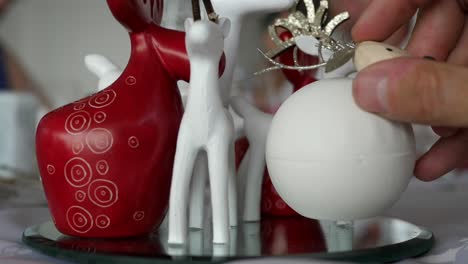 reindeer and sheep christmas decorations sitting on table