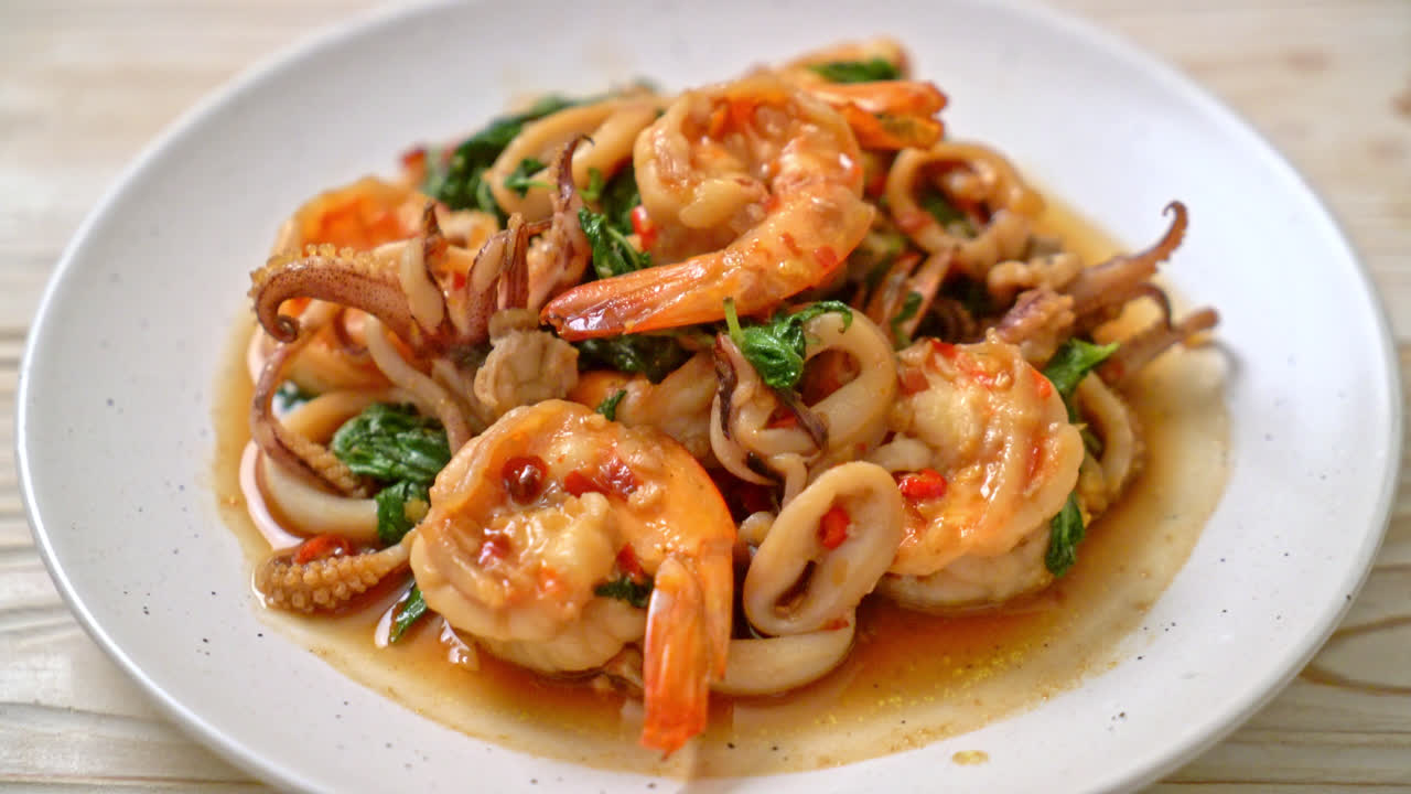 stir-fried seafood (shrimps and squid) with Thai basil - Asian food style