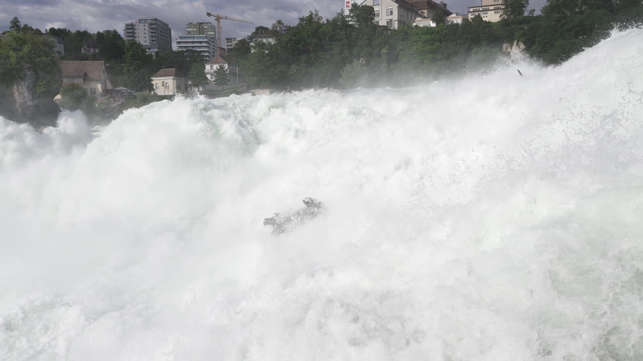 Waterfall crashing down powerfully in Norway with mist and foam