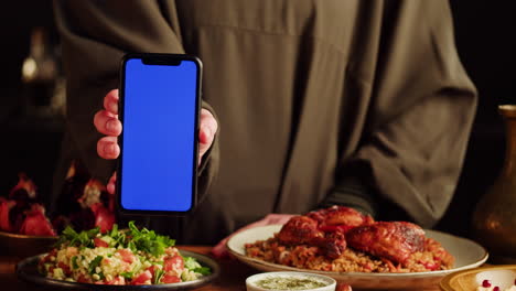 food presentation with mobile phone display