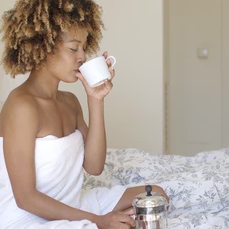 beautiful young woman sitting in bed