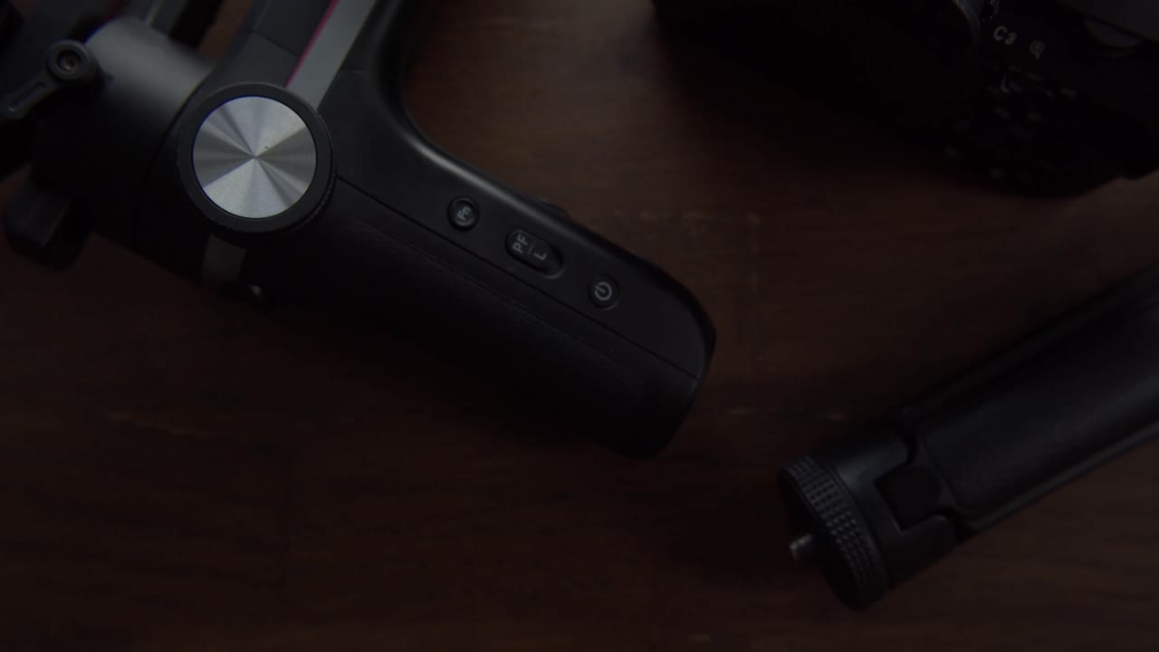 Closeup videography gear equipment flat lay stabilizer and camera body