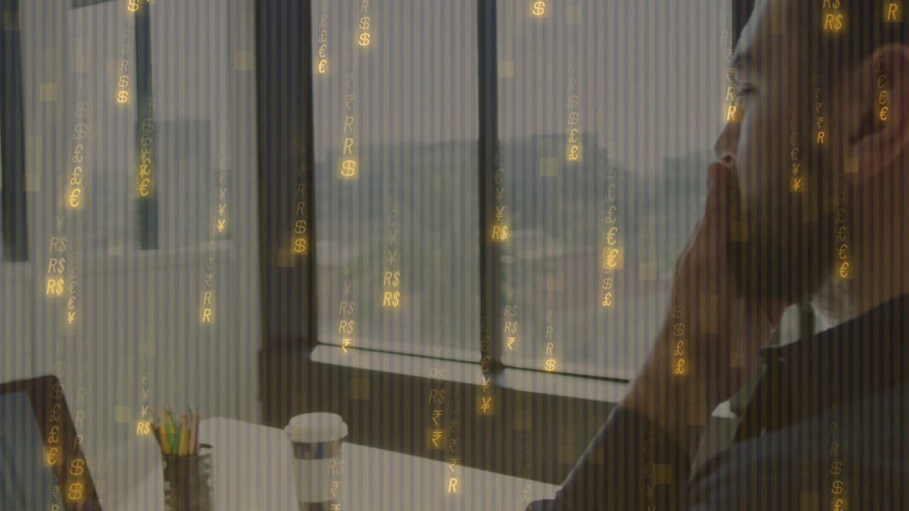 Businessman thinking at desk with currency symbols animation over office window