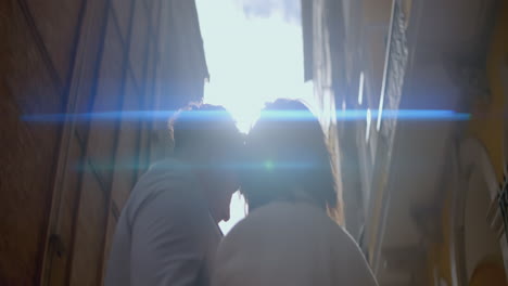 couple sharing a moment in a city alley