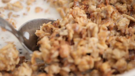mixing granola with milk